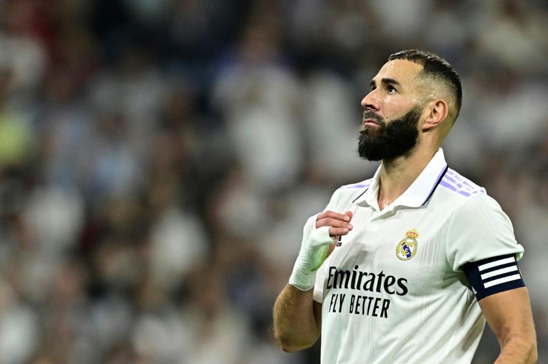 Real Madrid's French forward Karim Benzema reacts to missing a penalty kick against Osasuna.