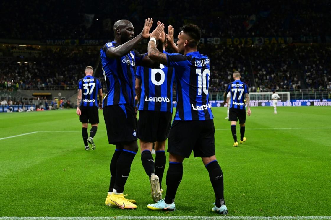 Romelu Lukaku (left) congratulates Lautaro Martinez for Inter Milan's opener  against Spezia