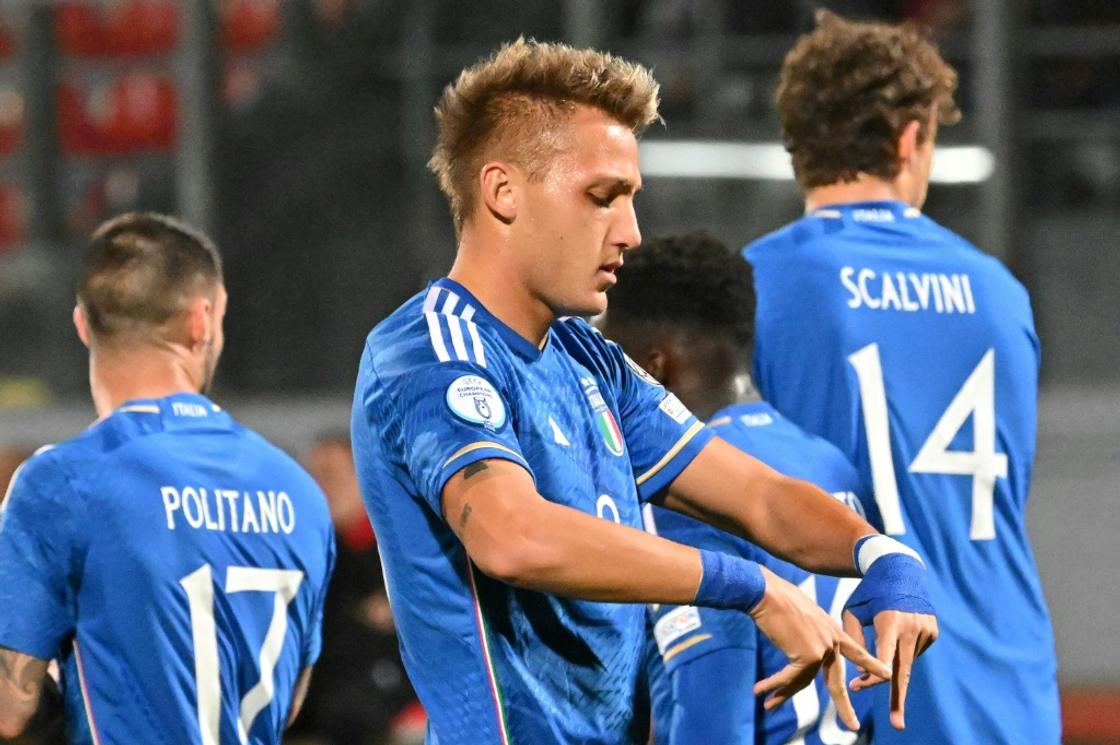 On target: Italy's Mateo Retegui celebrates after scoring