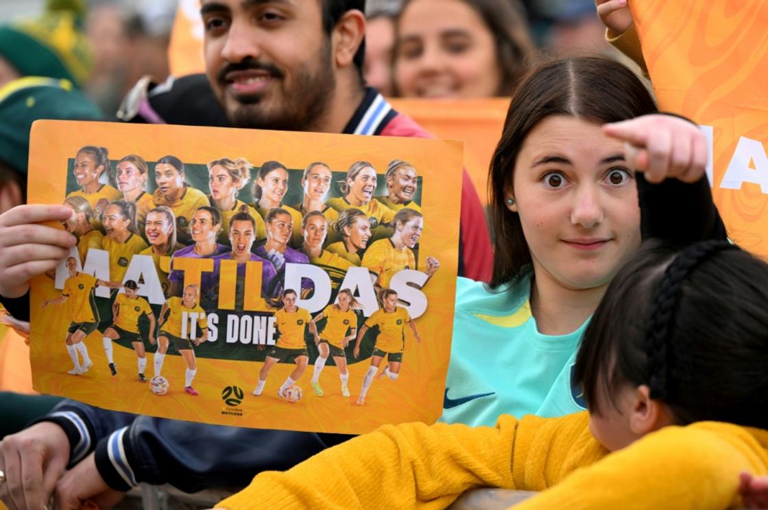 Fans cheer the Australia's women's football team during a public event