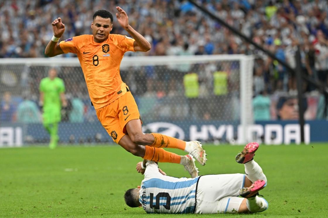 Cody Gakpo, pictured in action against Argentina in the World Cup in Qatar, is one of five Dutch players ruled out of the Euro 2024 qualifier against France by a virus
