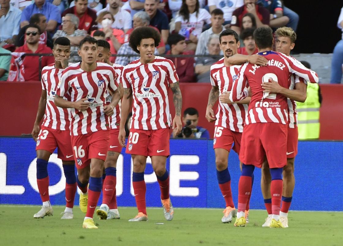 Atletico Madrid's Spanish midfielder Marcos Llorente celebrates after scoring against Sevilla.