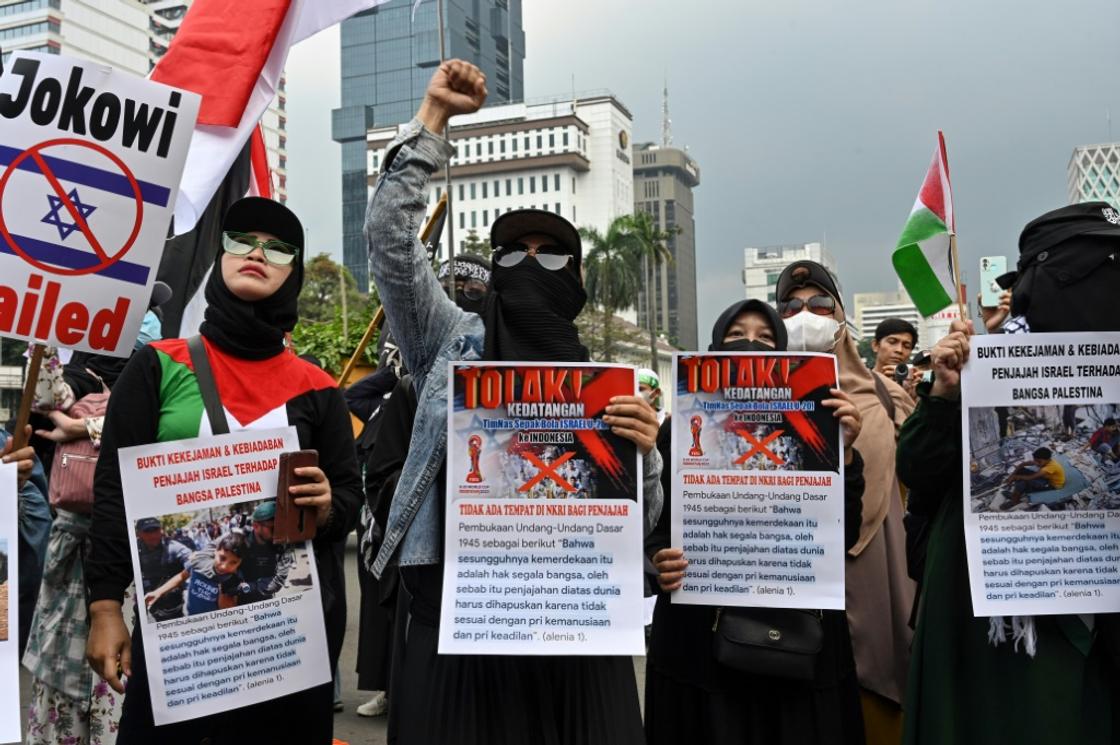 Indonesians shouted anti-Israel slogans over its participation in the tournament at a Jakarta march