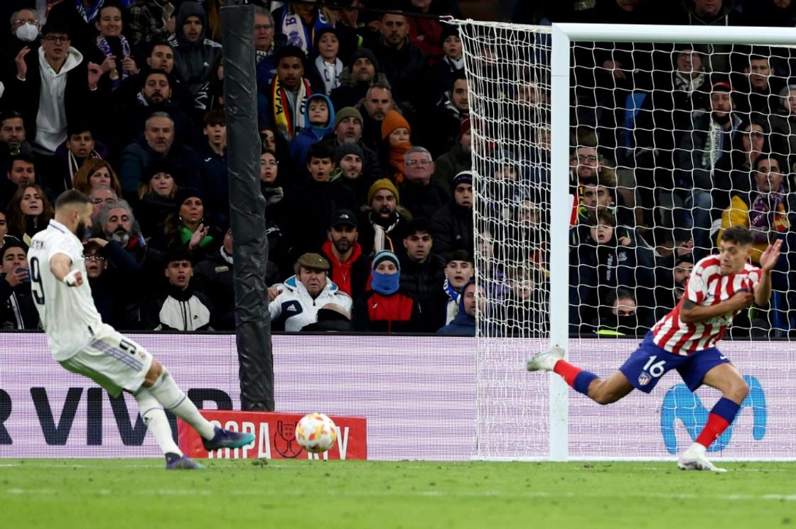 Extra special: Real Madrid forward Karim Benzema scores in extra-time against rivals Atletico Madrid