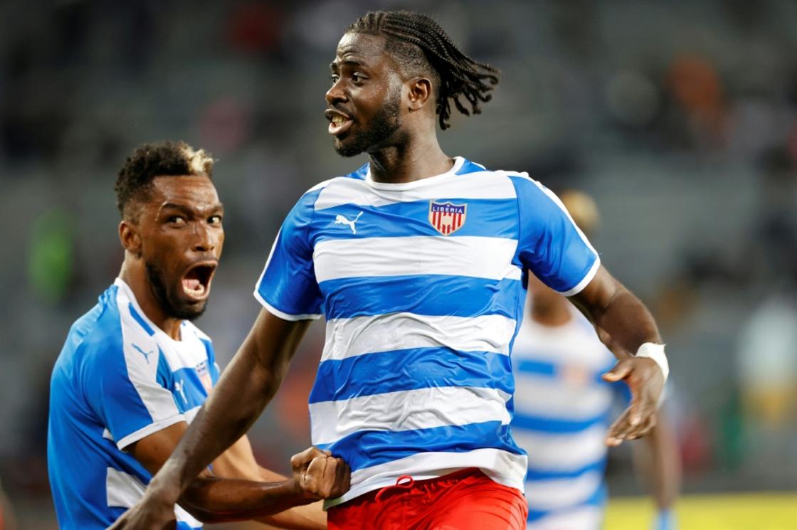 Level up: Mohammed Sangare (R) celebrates equalising for Liberia against South Africa in Soweto
