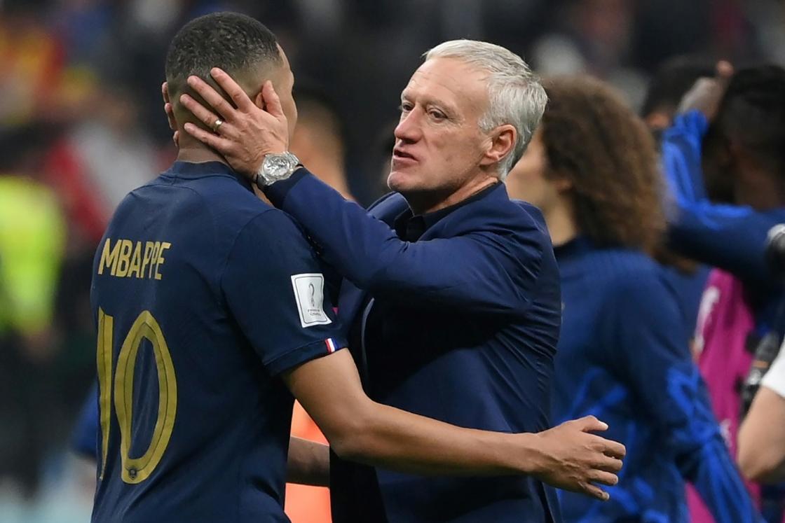 France coach Didier Deschamps embraces Kylian Mbappe after his side beat Morocco to reach the World Cup final