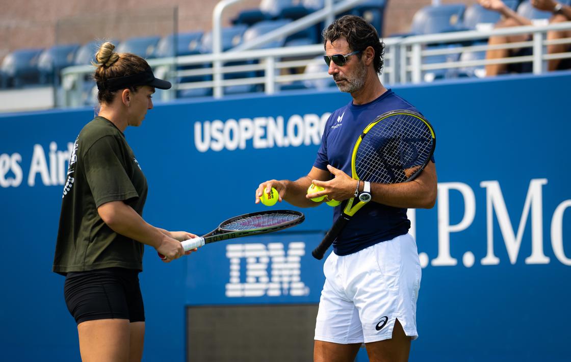 NEW YORK, NEW YORK - AUGUST 25: Simona Halep of Romania with coach Patrick Mouratoglou during practice ahead of the 2022 US Open Tennis Championships.SHe is one of the best female tennis players in the world.
