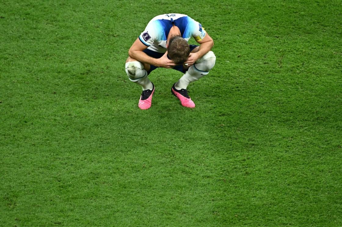 England striker Harry Kane slumps to the turf after the World Cup quarter-final exit to France