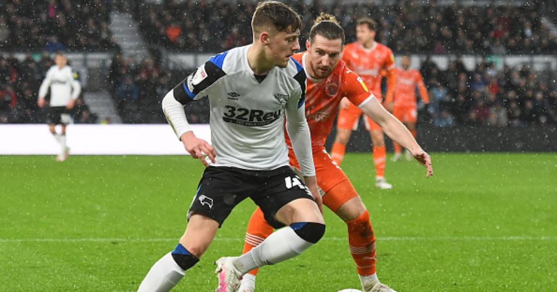 Dylan Williams shields the ball from James Husband of Blackpool during the Sky Bet Championship match between Derby County and Blackpool at the Pride Park, Derby on Saturday 11th December 2021. (Photo by Jon Hobley/MI News/NurPhoto via Getty Images)