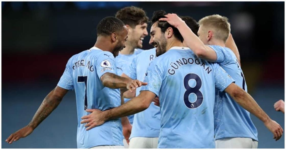 Man City players celebrating a goal during the 2020/21 season. Photo: Getty Images.