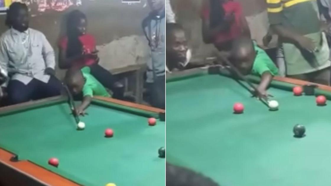 Bright eyed pool prodigy dismantles his elder in a game of pool