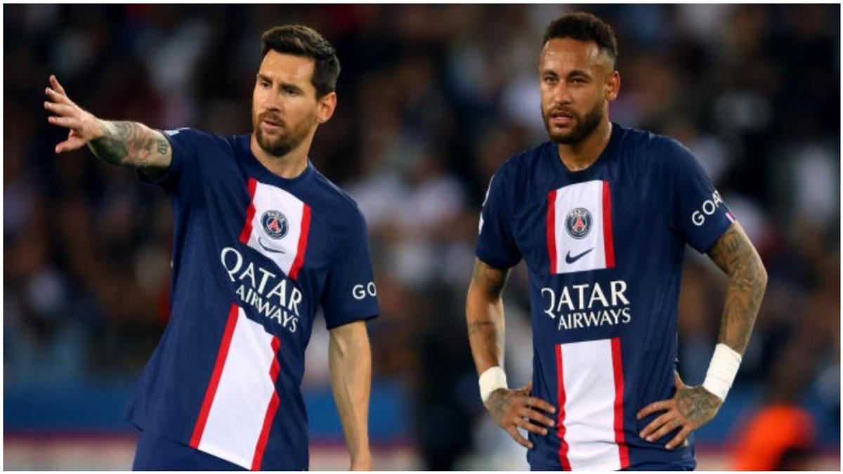 Lionel Messi and Neymar of Barcelona stand on the field in the