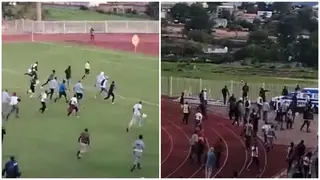 Match referee runs for his life as angry fans storm football pitch 'to deal with him'