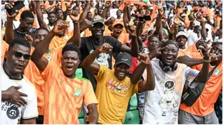 Ivorian fan apologises to wife after he was spotted chatting to young woman during Senegal game