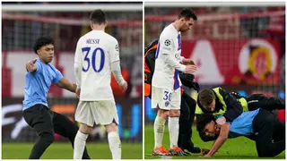 Watch Lionel Messi almost get knocked down by a pitch invader after PSG's UCL loss