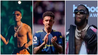 Heartwarming moment Man United star Jadon Sancho vibes to Burna Boy and Wizkid’s Ballon d’Or during workout