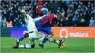 Zaha reacts to Wan-Bissaka's last-ditch tackle that denied Crystal Palace chance to sink Man United