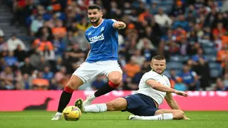 Rangers hit 10-man Hearts for four to go top