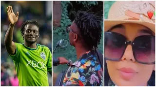 Obafemi Martins Takes Beautiful Wife on Motorbike Cruise Around Local Nigerian Community