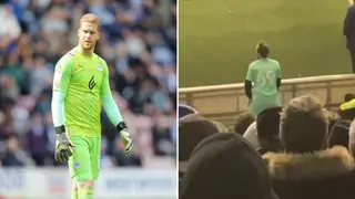 Wigan fan has supporters in stitches, warms up in the stands after goalkeeper Ben Amos goes down injured