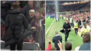 Diego Simeone Forced to Take Cover as Man United Fans Attack Him After Atletico's Win at Old Trafford