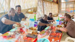 Photos Of Michael Essien And Stephen Appiah Eating TZ At A Chop Bar Go Viral