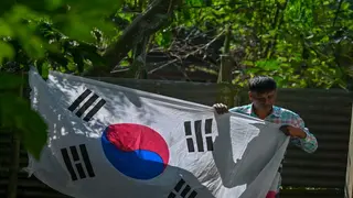 Spurning World Cup favourites, Bangladeshi duo hoist South Korean colours