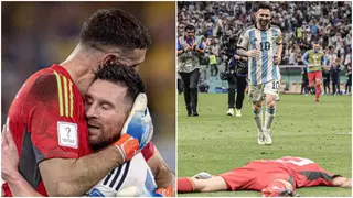 Messi celebrates Emi Martinez after penalty heroics against Holland