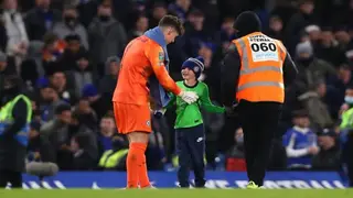 Heartwarming footage of Chelsea keeper as he saves young pitch invader from steward