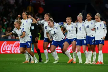 England's players celebrate after the winning penalty