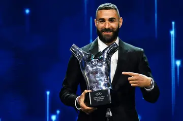 Karim Benzema poses with the UEFA men's player of the year prize in Istanbul on Thursday