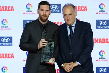 Lionel Messi with La Liga president, Javier Tebas during the Argentine's successful time with Barcelona.