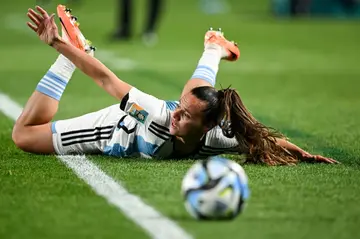 Argentina's midfielder Florencia Bonsegundo on the ground after a challenge