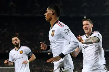 Marcus Rashford (C) celebrates after scoring Manchester United's equaliser in their 2-2 draw with Barcelona at the Camp Nou