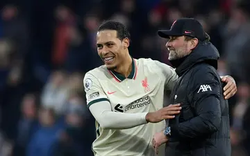 Virgil van Dijk (left) is hoping to give Jurgen Klopp (right) the perfect send off as Liverpool manager