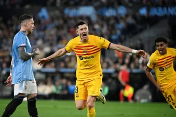 Barcelona striker Robert Lewandowski hit a brace against Celta Vigo to give his team victory in Galicia