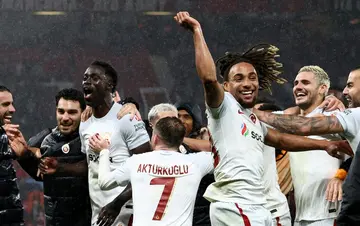 Galatasaray players celebrate a 3-2 victory over Manchester United