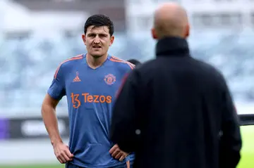 Manchester United's Harry Maguire talks to manager Erik ten Hag
