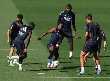 Real Madrid forward Vinicius Junior (C) appeared in court via video-conference after being racially abused in May while playing in Valencia