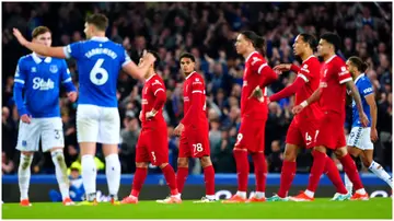 Liverpool and Everton players look on during their Premier League match at Goodison Park. Photo by Peter Byrne.