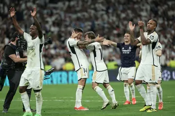 Joselu (C) celebrates with team-mates after his goals in the 88th and 91st minutes gave Real Madrid a stunning 2-1 comeback win over Bayern Munich to qualify for the Champions League final