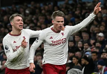 Manchester United's Scott McTominay (R) celebrates scoring the winner at Aston Villa