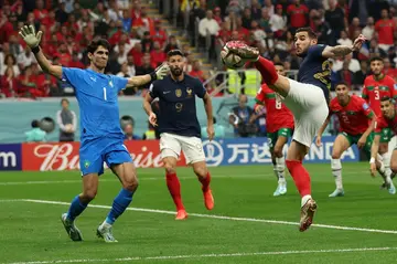 Theo Hernandez volleys in France's early opening goal in their World Cup semi-final clash with Morocco