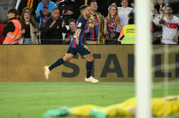 Barcelona defender Jordi Alba celebrates scoring a late winner against Osasuna at Camp Nou