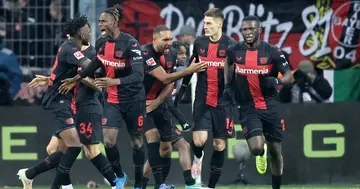 Victor Boniface celebrates with his teammates after scoring the team's first goal during the Bundesliga match between Bayer 04 Leverkusen and Borussia Dortmund.
