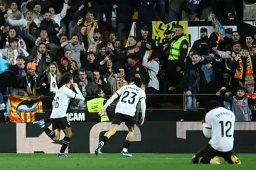 Valencia's Spanish midfielder Hugo Guillamon celebrates scoring the equaliser against Barcelona in La Liga on Sunday