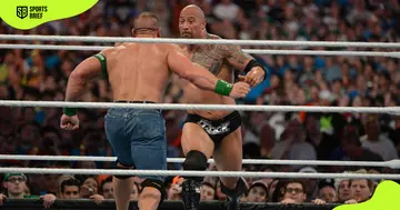 Dwayne 'The Rock' Johnson (r) wrestles during WrestleMania XXVIII.
