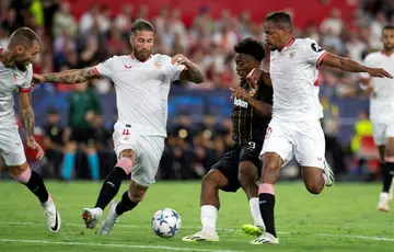 Sergio Ramos (centre) in last week's Champions League match while his home was being raided