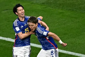 Japan's Ritsu Doan (right) celebrates scoring his team's first goal against Germany in the World Cup