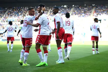 Ruben Aguilar (L) congratulates  Sofiane Diop (C) after the latter scored Monaco's second goal against Strasbourg